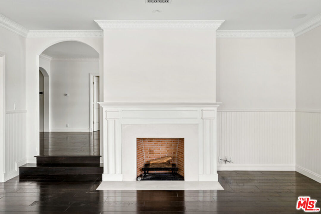 9233 1/2 Doheny Road West Hollywood, CA 90069 - Photo 4 of 17 a living room with furniture and a fireplace