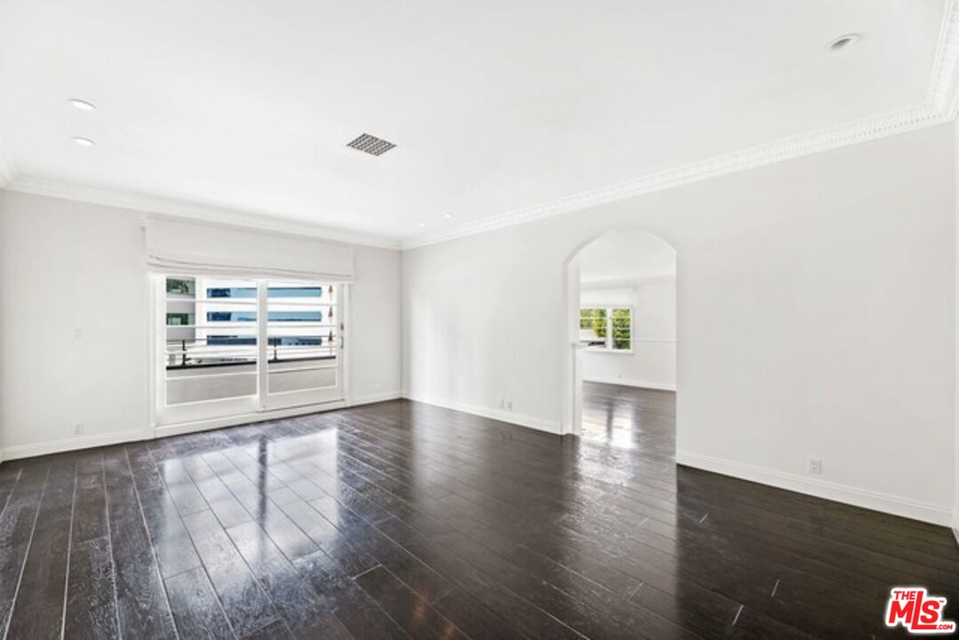 9233 1/2 Doheny Road West Hollywood, CA 90069 - Photo 6 of 17 wooden floor in an empty room with a window
