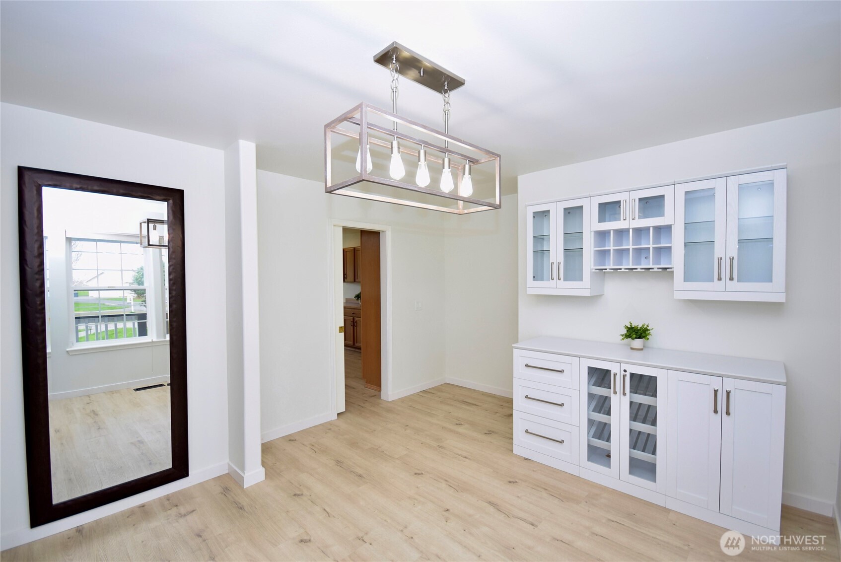 71 John Carl Road Sequim, WA 98382 - Photo 13 of 37 a view of an empty room with chandelier and wooden floor