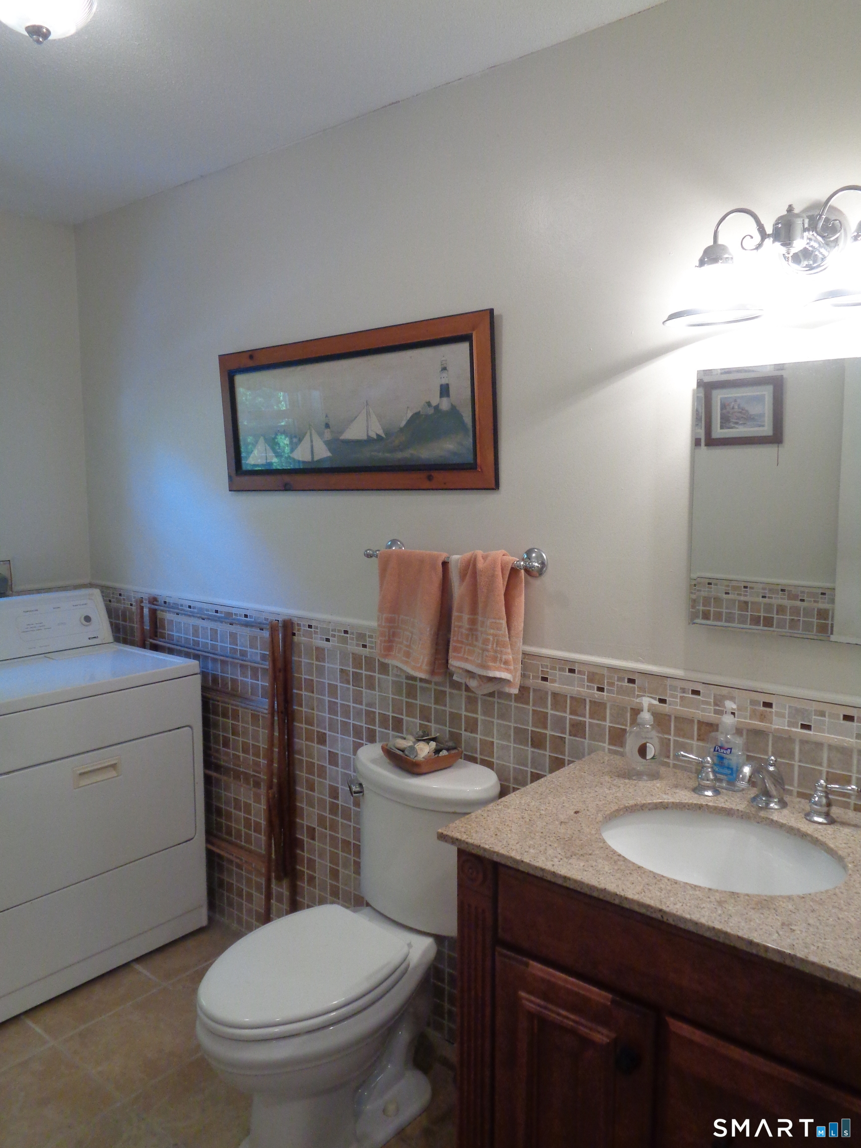 321 Spring Street Naugatuck, CT 06770 - Photo 20 of 27 a bathroom with a toilet a sink and mirror