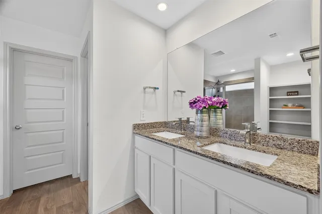 a kitchen with kitchen island granite countertop cabinets and granite counter tops