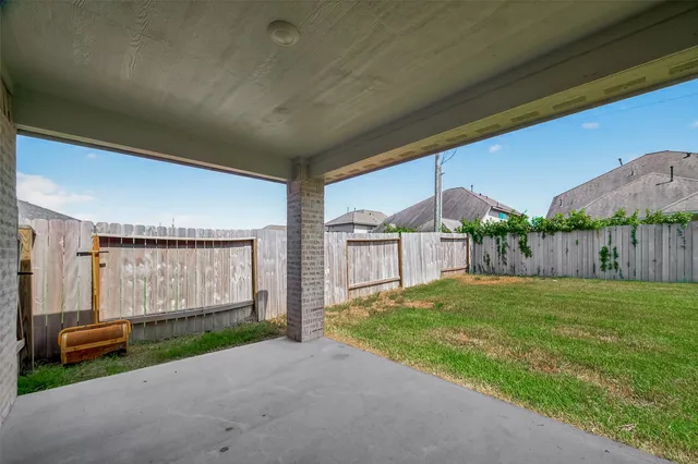 a view of a house with a yard and garage