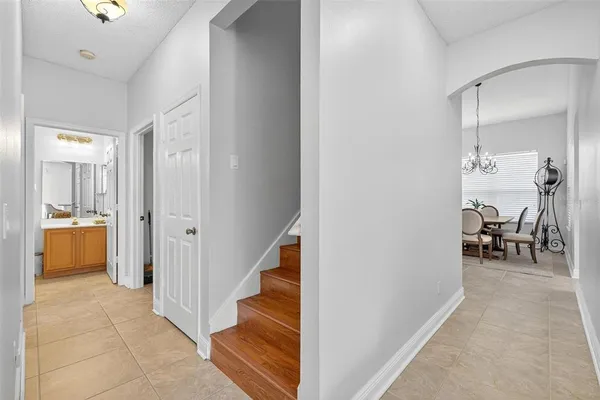 a view of a hallway with wooden floor and workspace
