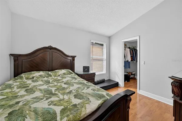 a livingroom with workspace couch and a window