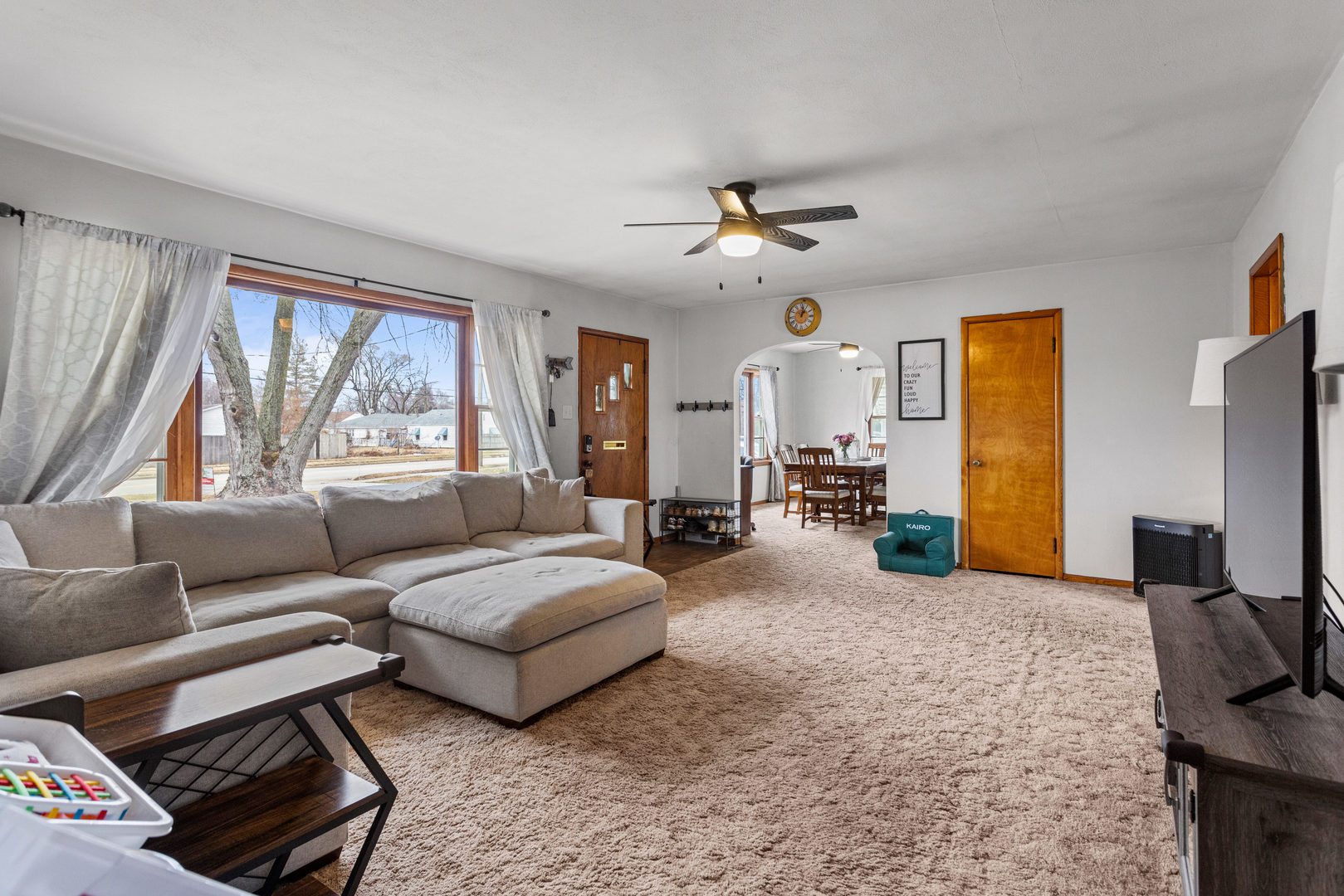 3235 West Main Street Decatur, IL 62522 - Photo 7 of 30 a living room with furniture and a flat screen tv