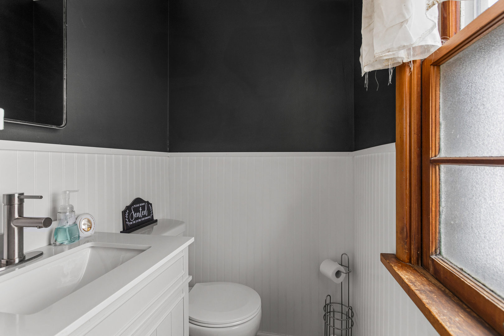 3235 West Main Street Decatur, IL 62522 - Photo 8 of 30 a bathroom with a toilet a sink and a mirror