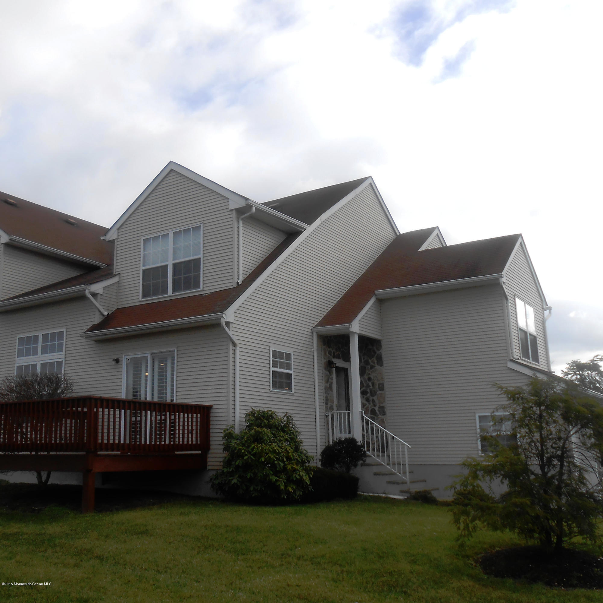 61 Racquet Road Wall, NJ 07719 - Photo 1 of 15 a view of a house with a yard and plants