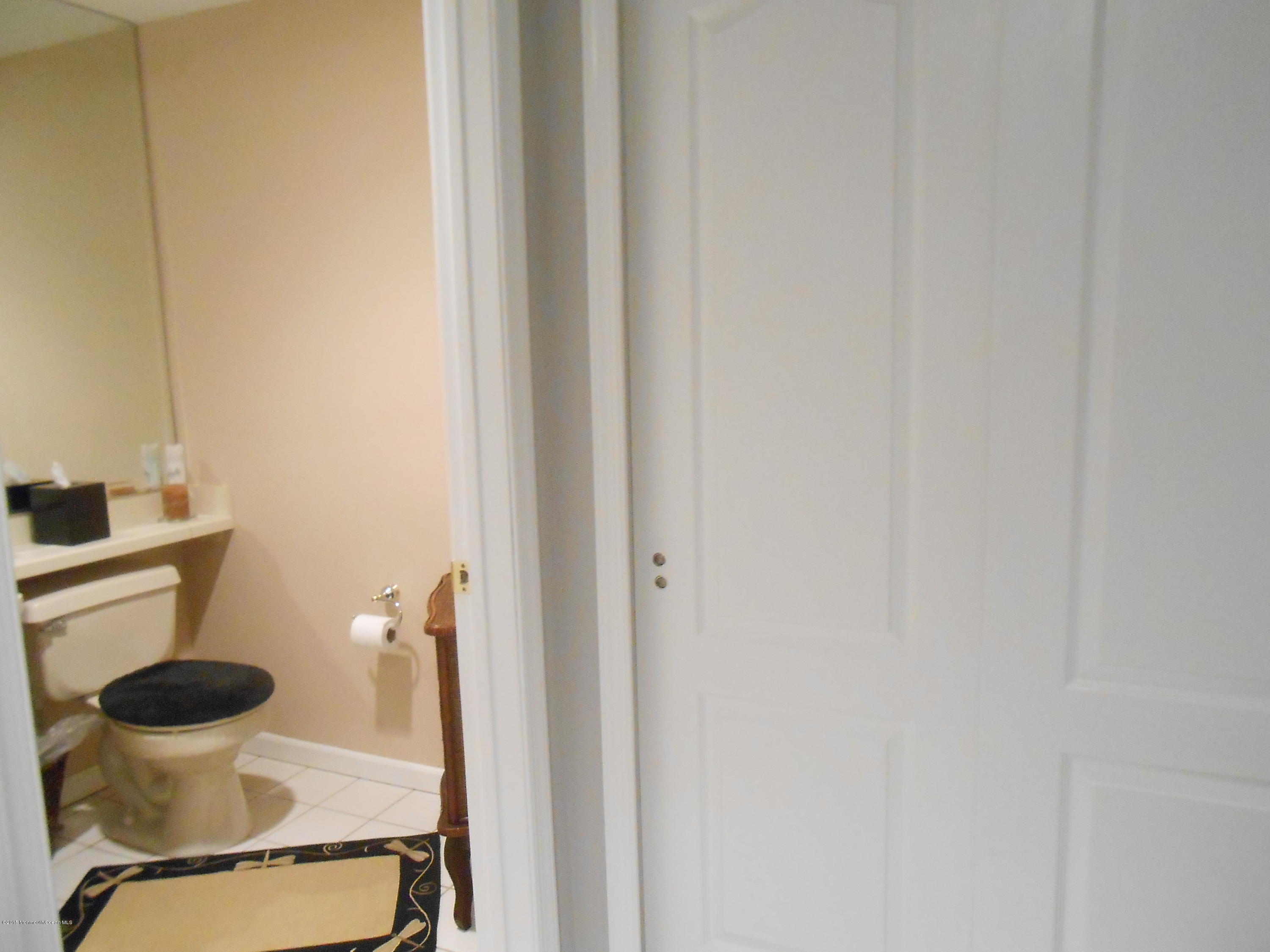 61 Racquet Road Wall, NJ 07719 - Photo 4 of 15 a bathroom with a toilet and a sink