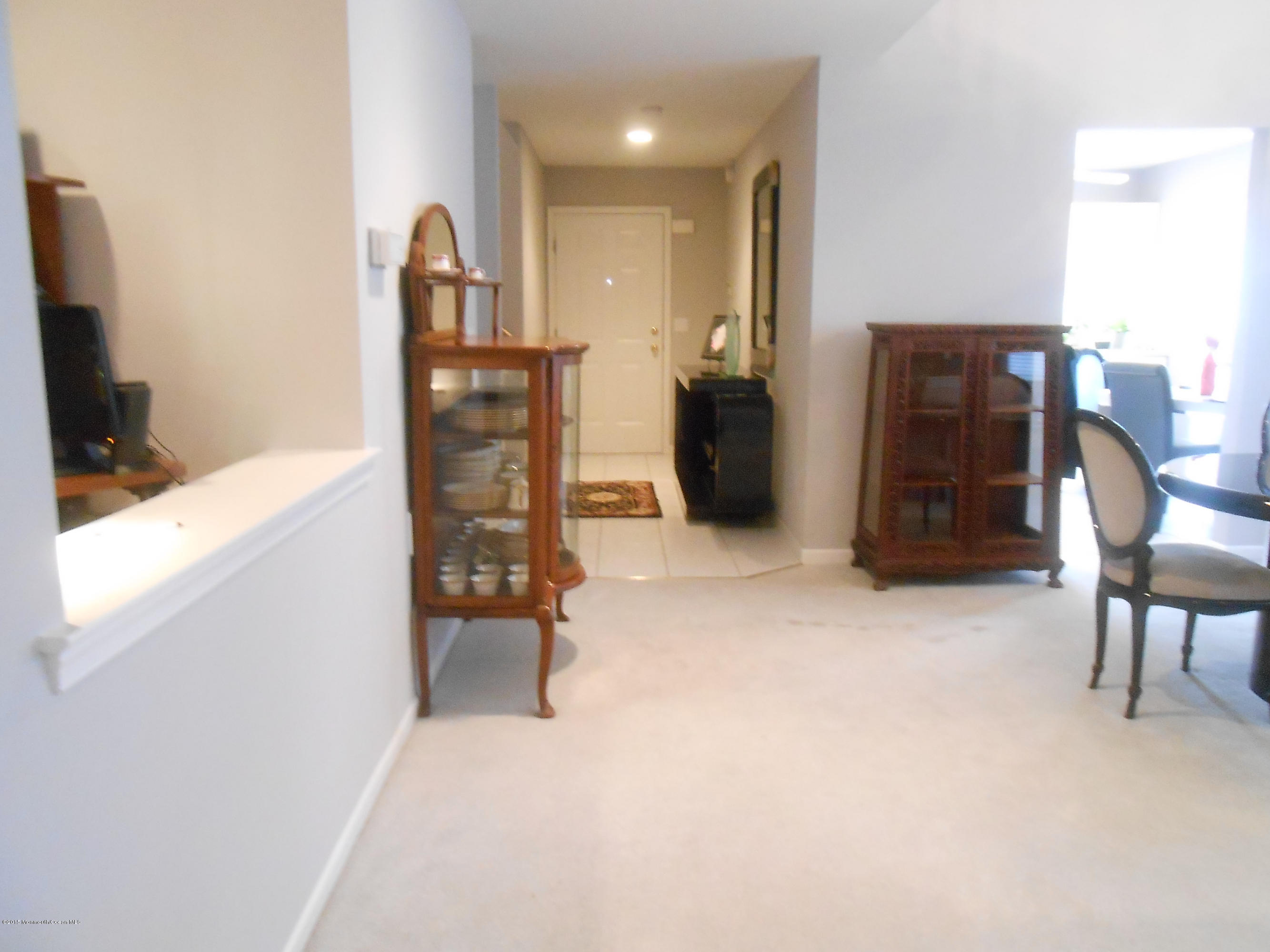 61 Racquet Road Wall, NJ 07719 - Photo 5 of 15 a view of a livingroom with furniture and a flat screen tv