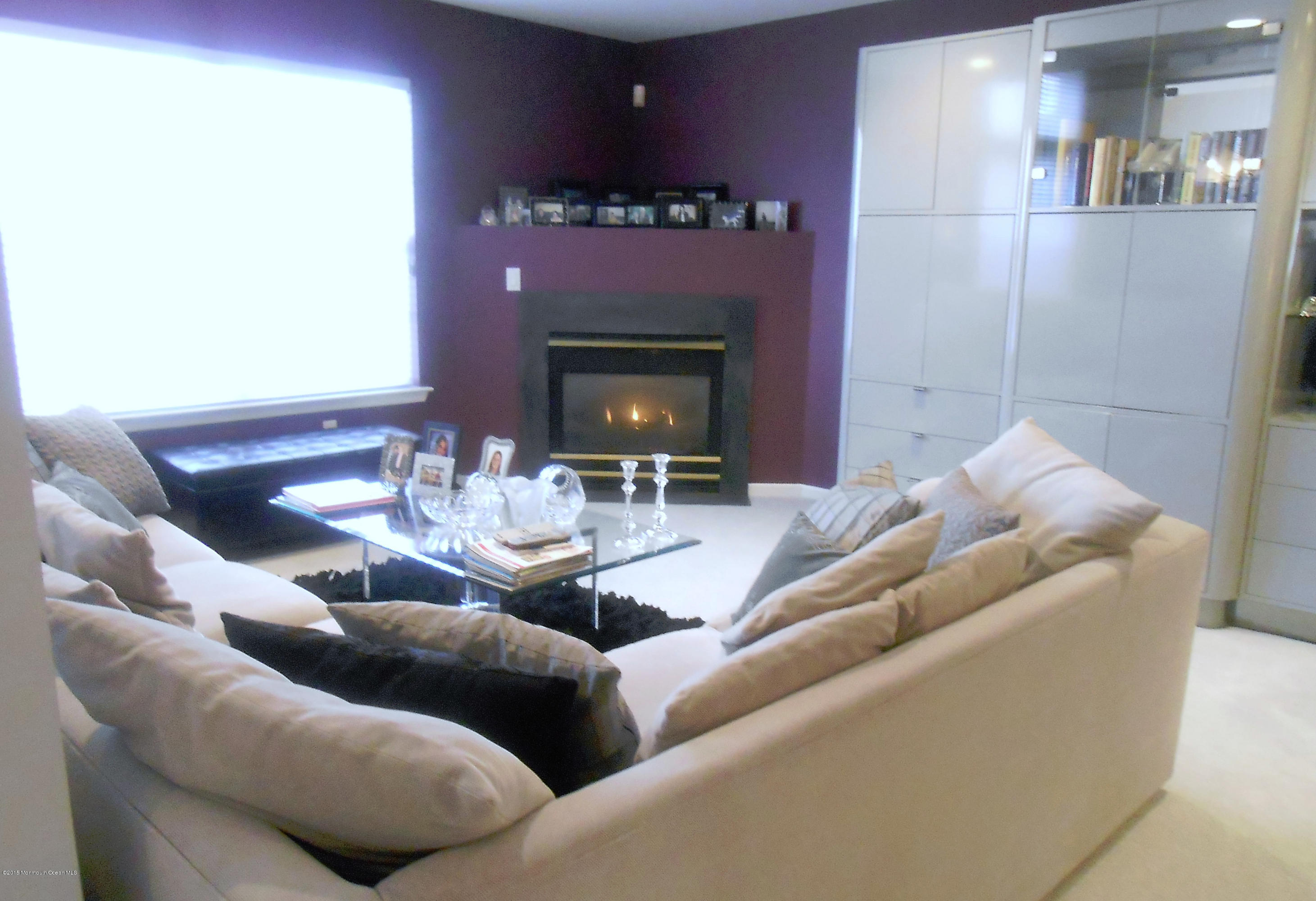 61 Racquet Road Wall, NJ 07719 - Photo 7 of 15 a living room with furniture and a fireplace