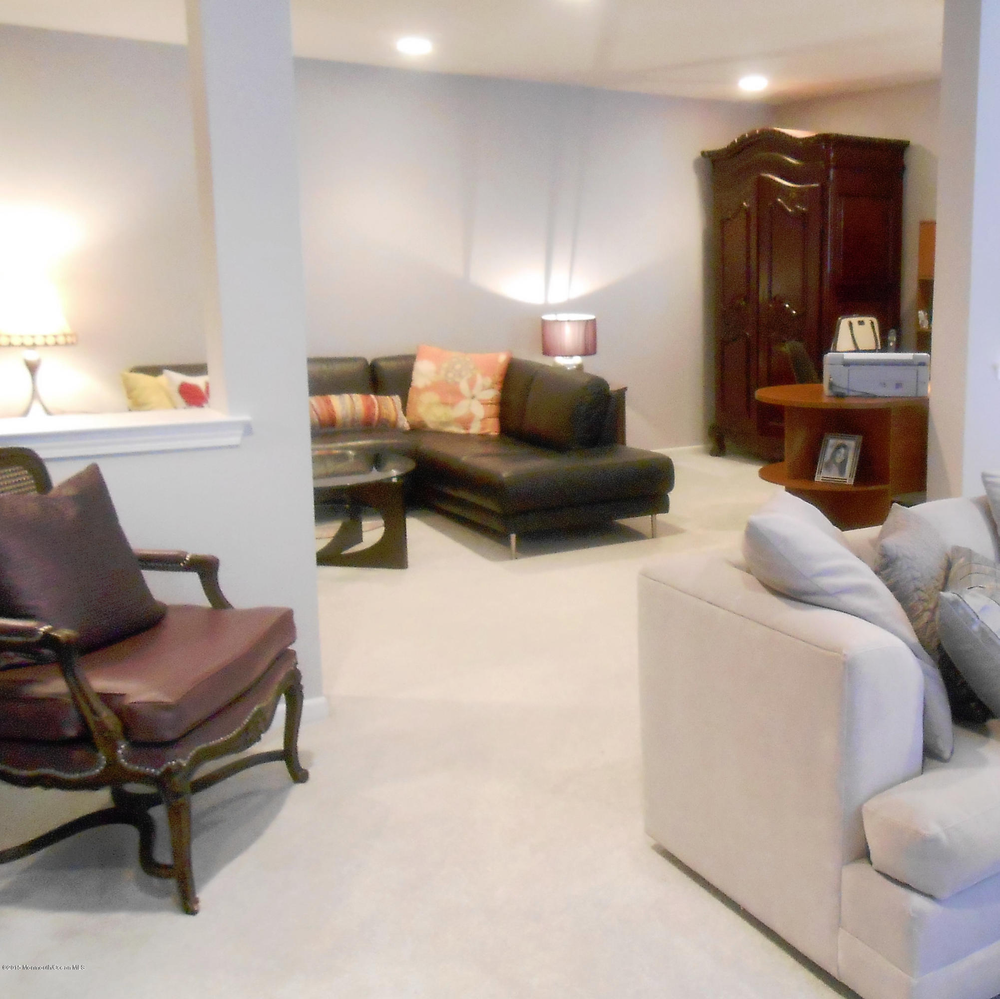61 Racquet Road Wall, NJ 07719 - Photo 8 of 15 a living room with furniture and a lamp