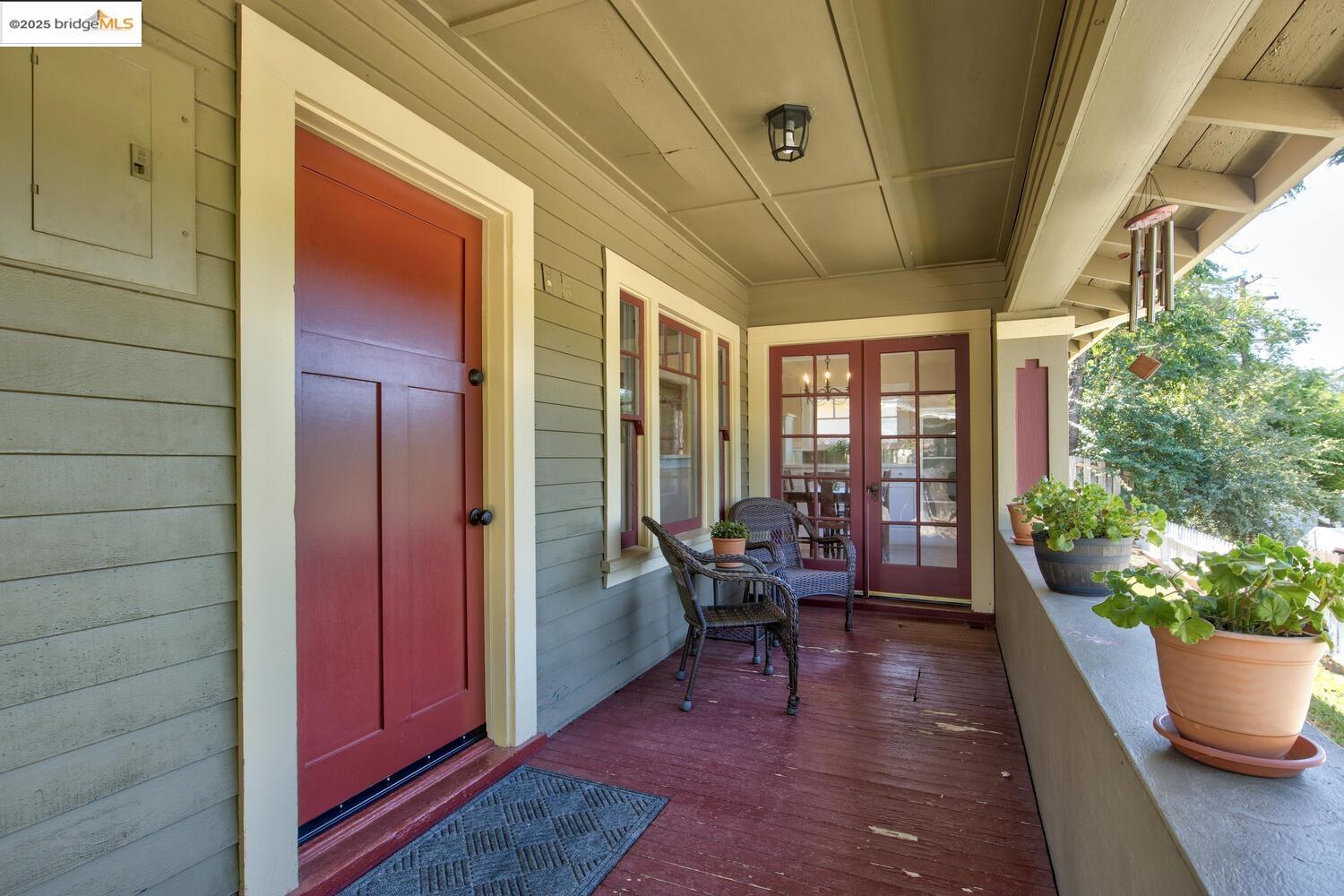 a lobby with furniture and potted plants
