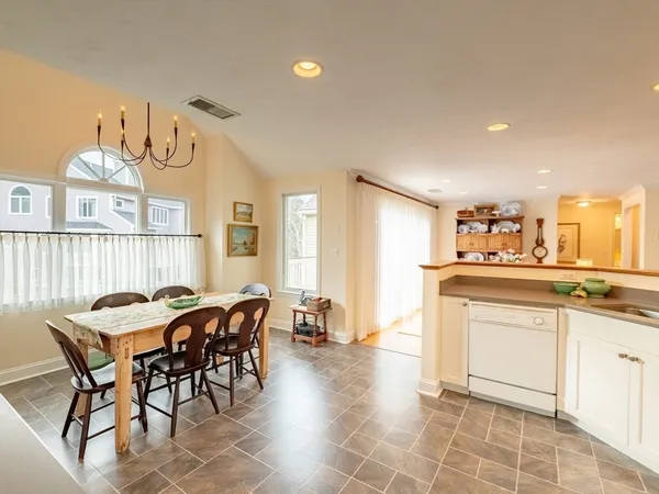 a kitchen with a dining table and chairs