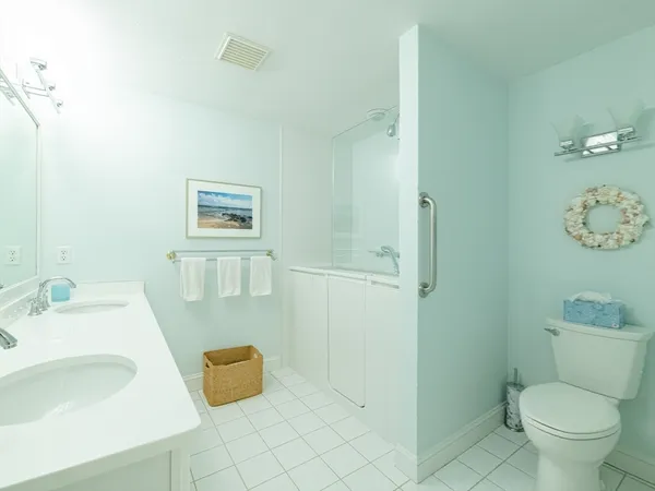 a bathroom with a sink a mirror and a shower