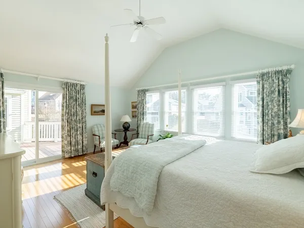 a bedroom with a bed a couch and dresser