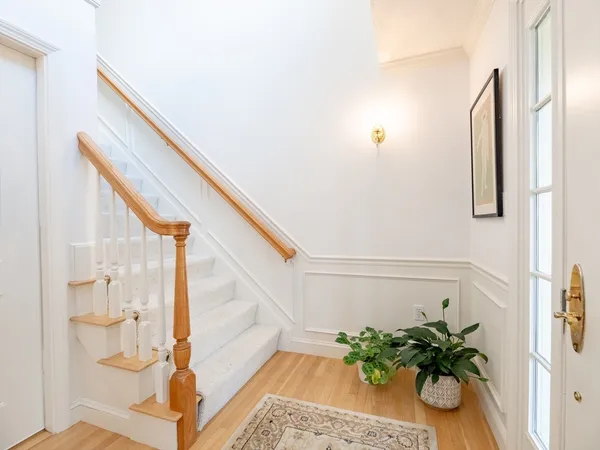 an entryway with wooden floor