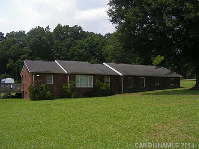 2022 Lawyers Road Indian Trail, NC 28079 - Photo 1 of 3 a view of a house next to a big yard