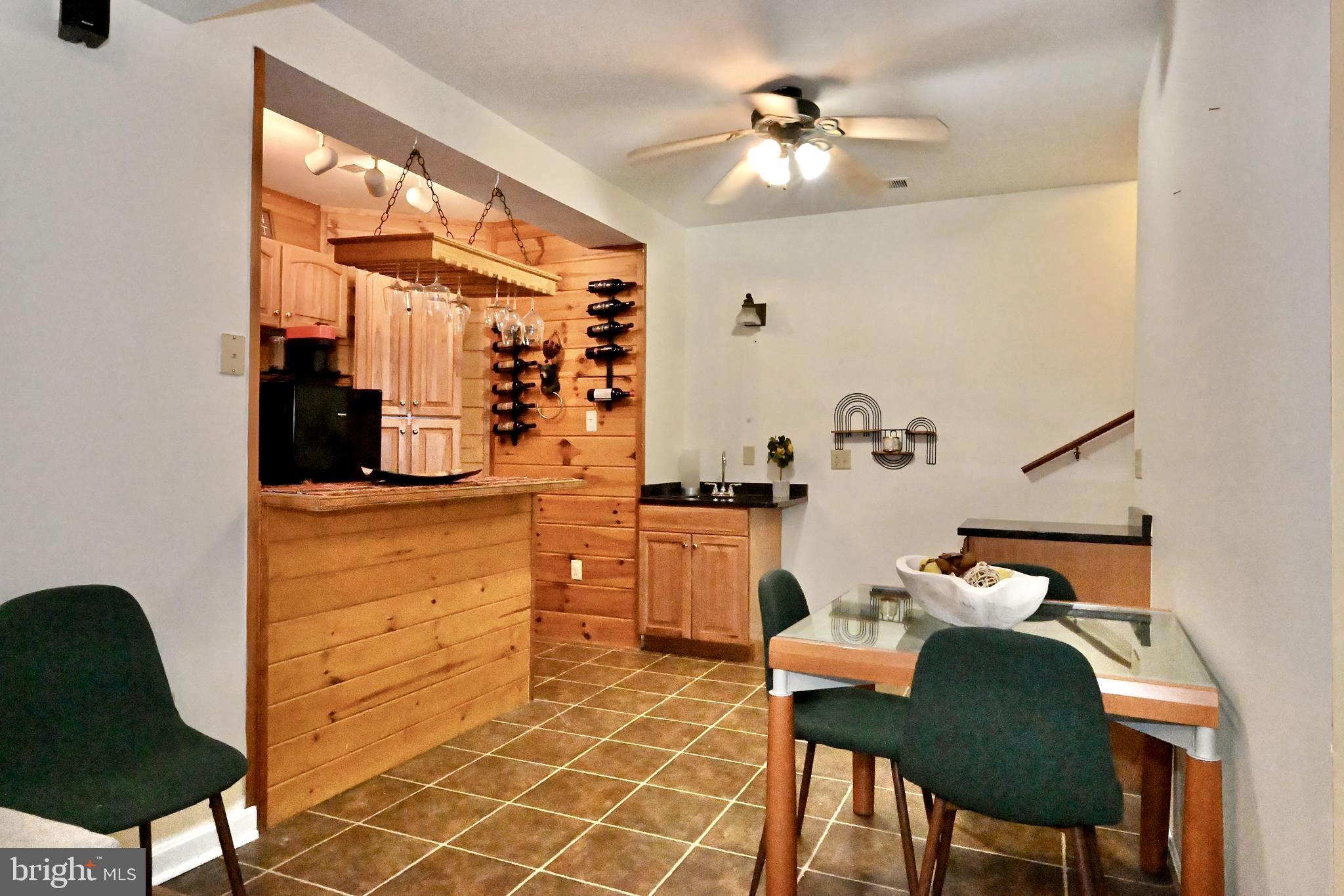 8051 Old Receiver Road Frederick, MD 21702 - Photo 36 of 54 Lower level's kitchenette with a table