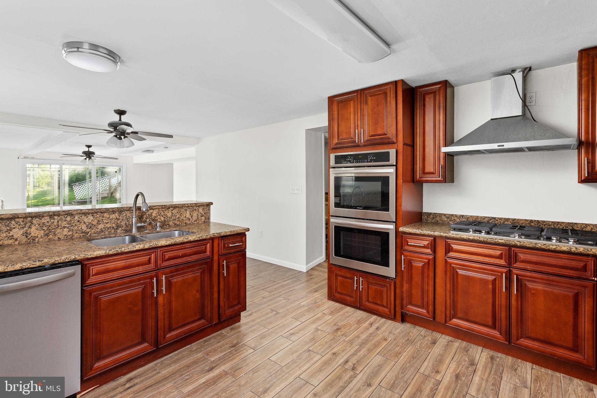2264 Pennington Road Trenton, NJ 08638 - Photo 11 of 24 a kitchen with stainless steel appliances granite countertop a stove and a sink