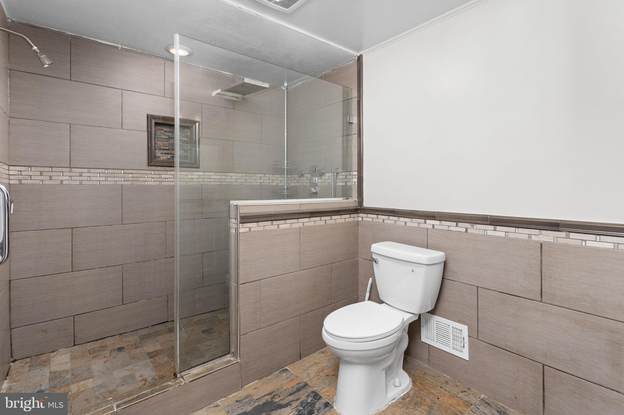 2264 Pennington Road Trenton, NJ 08638 - Photo 12 of 24 a bathroom with a toilet and a shower