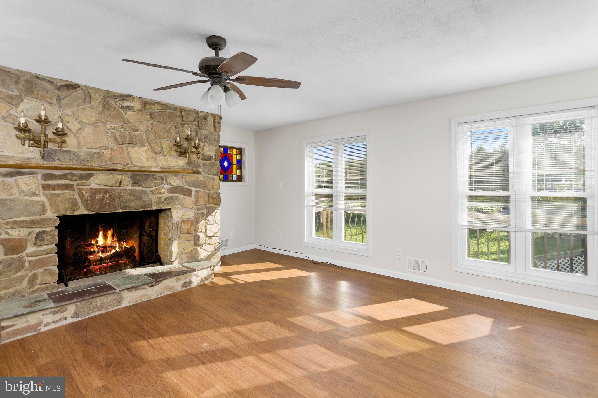 2264 Pennington Road Trenton, NJ 08638 - Photo 15 of 24 a view of an empty room with a fireplace and a window