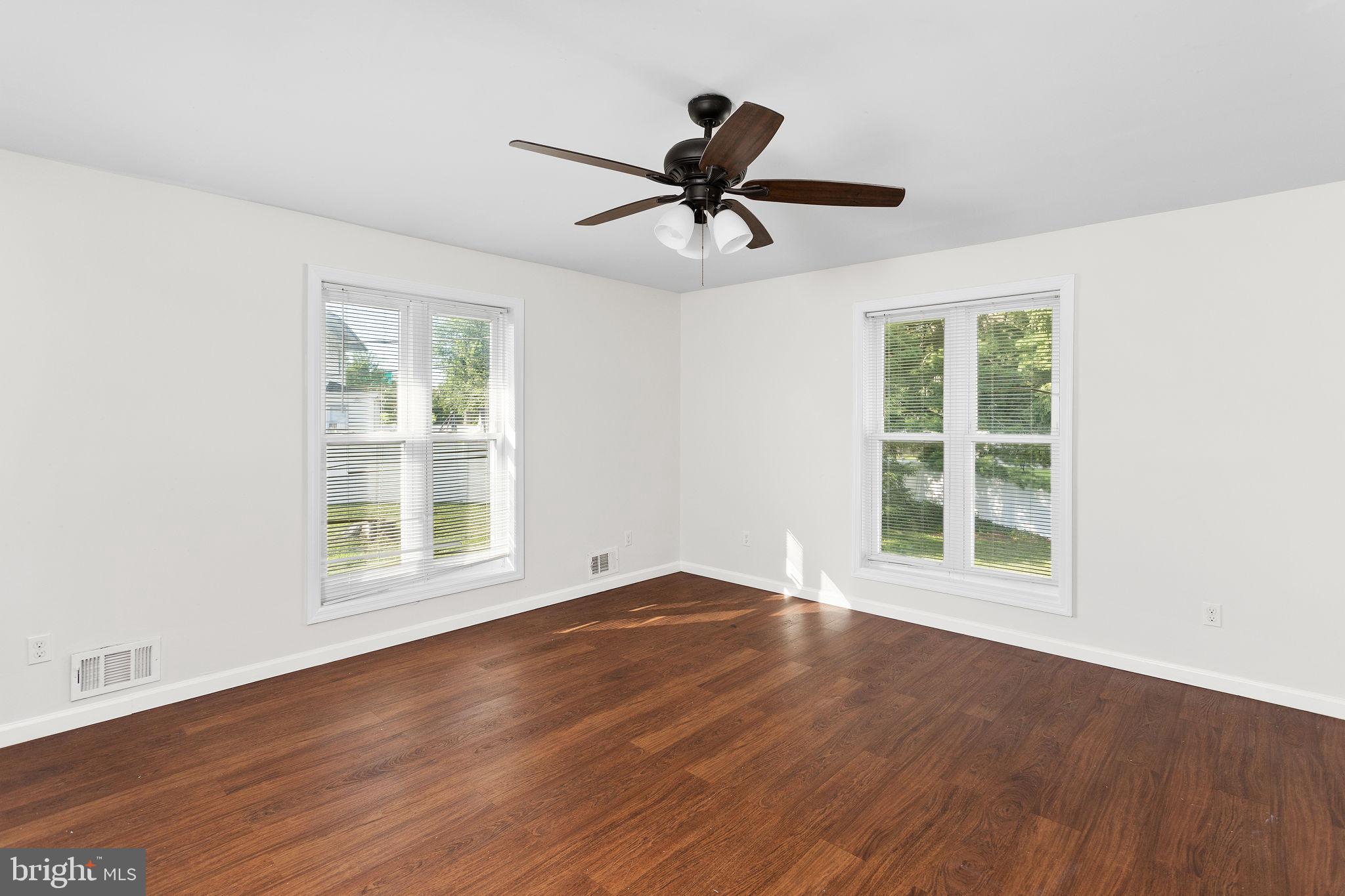 2264 Pennington Road Trenton, NJ 08638 - Photo 17 of 24 a view of an empty room with wooden floor and a window