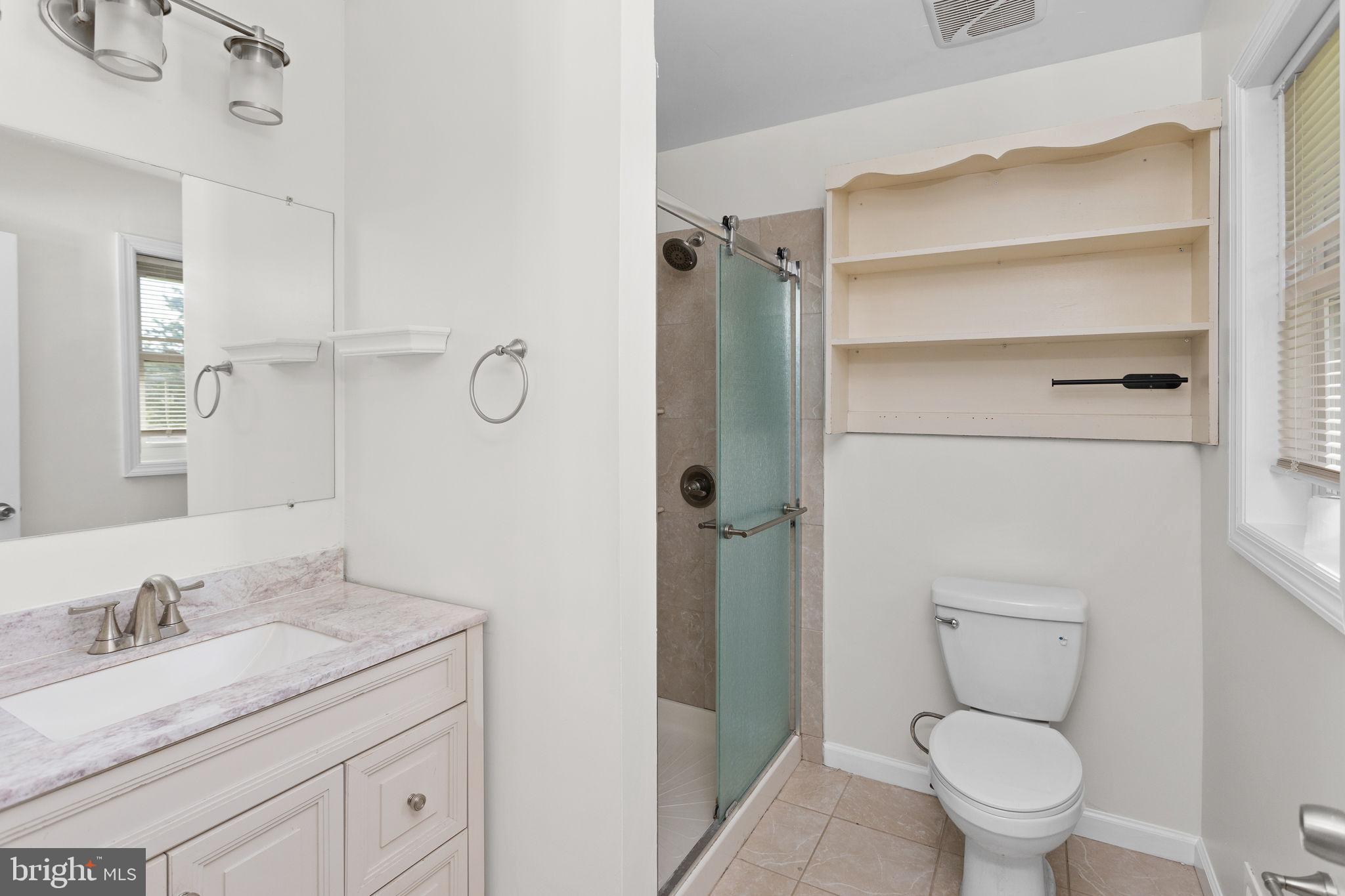 2264 Pennington Road Trenton, NJ 08638 - Photo 18 of 24 a bathroom with a granite countertop sink toilet and shower
