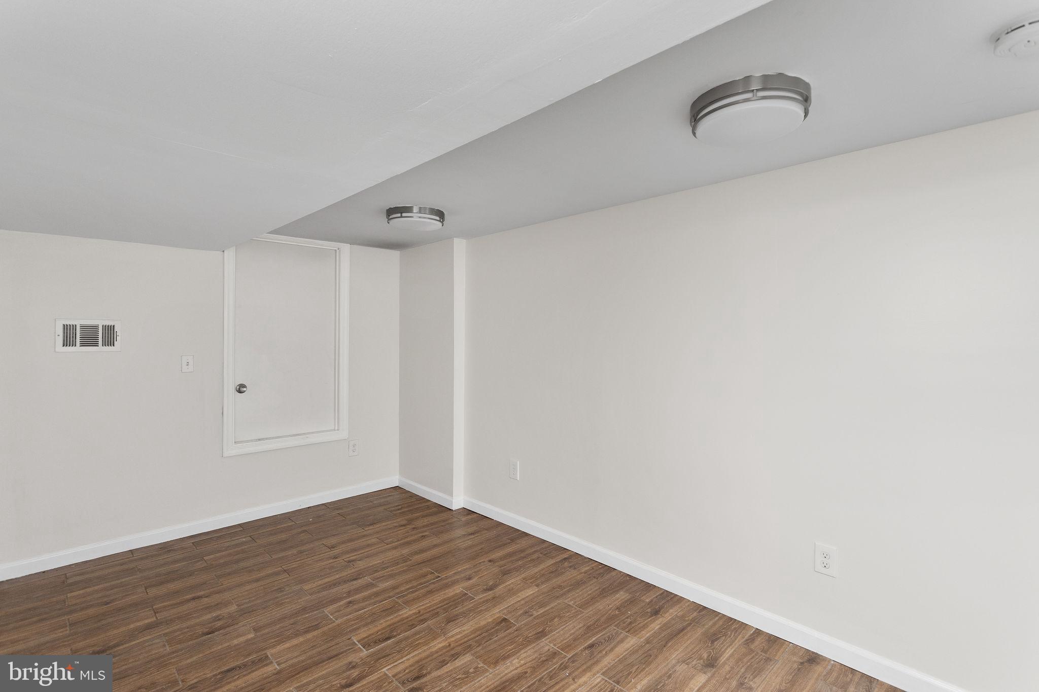 2264 Pennington Road Trenton, NJ 08638 - Photo 19 of 24 a view of empty room with wooden floor