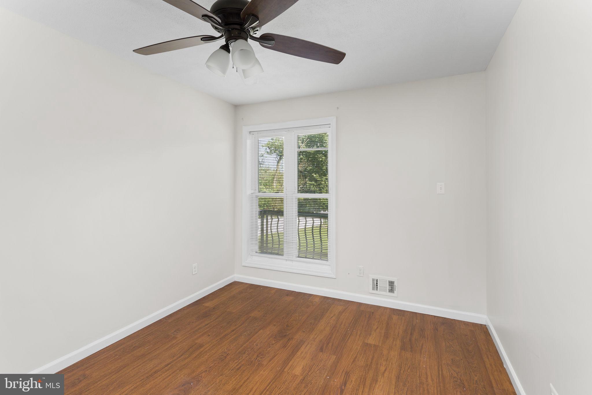 2264 Pennington Road Trenton, NJ 08638 - Photo 20 of 24 an empty room with a window and a fan