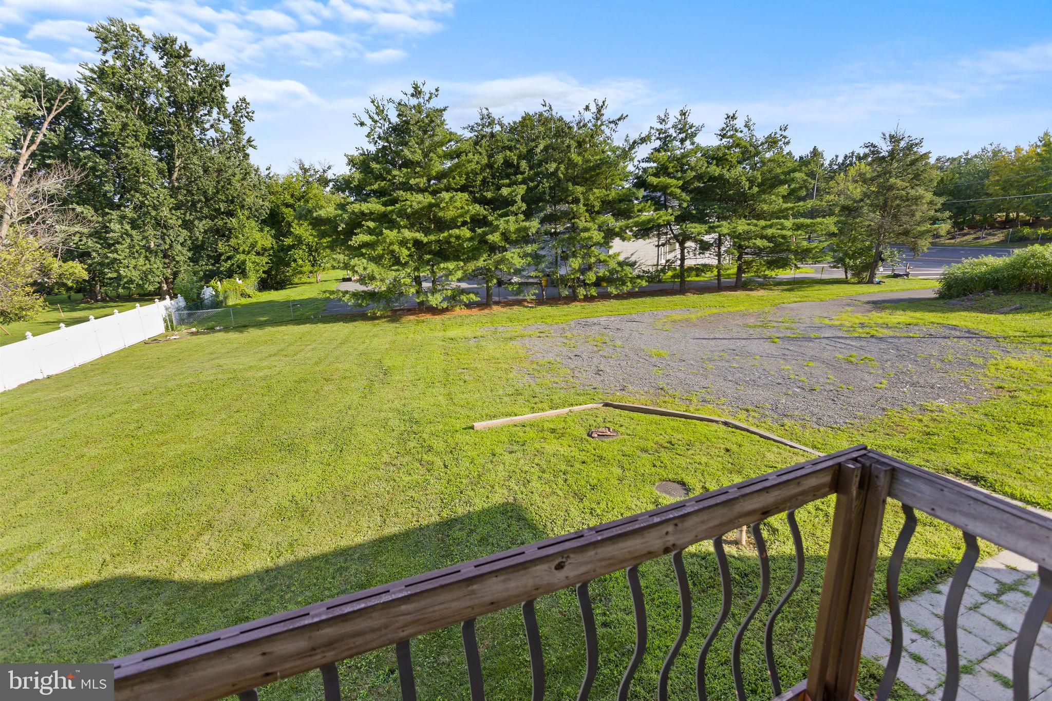 2264 Pennington Road Trenton, NJ 08638 - Photo 21 of 24 a view of an outdoor swimming pool and trees
