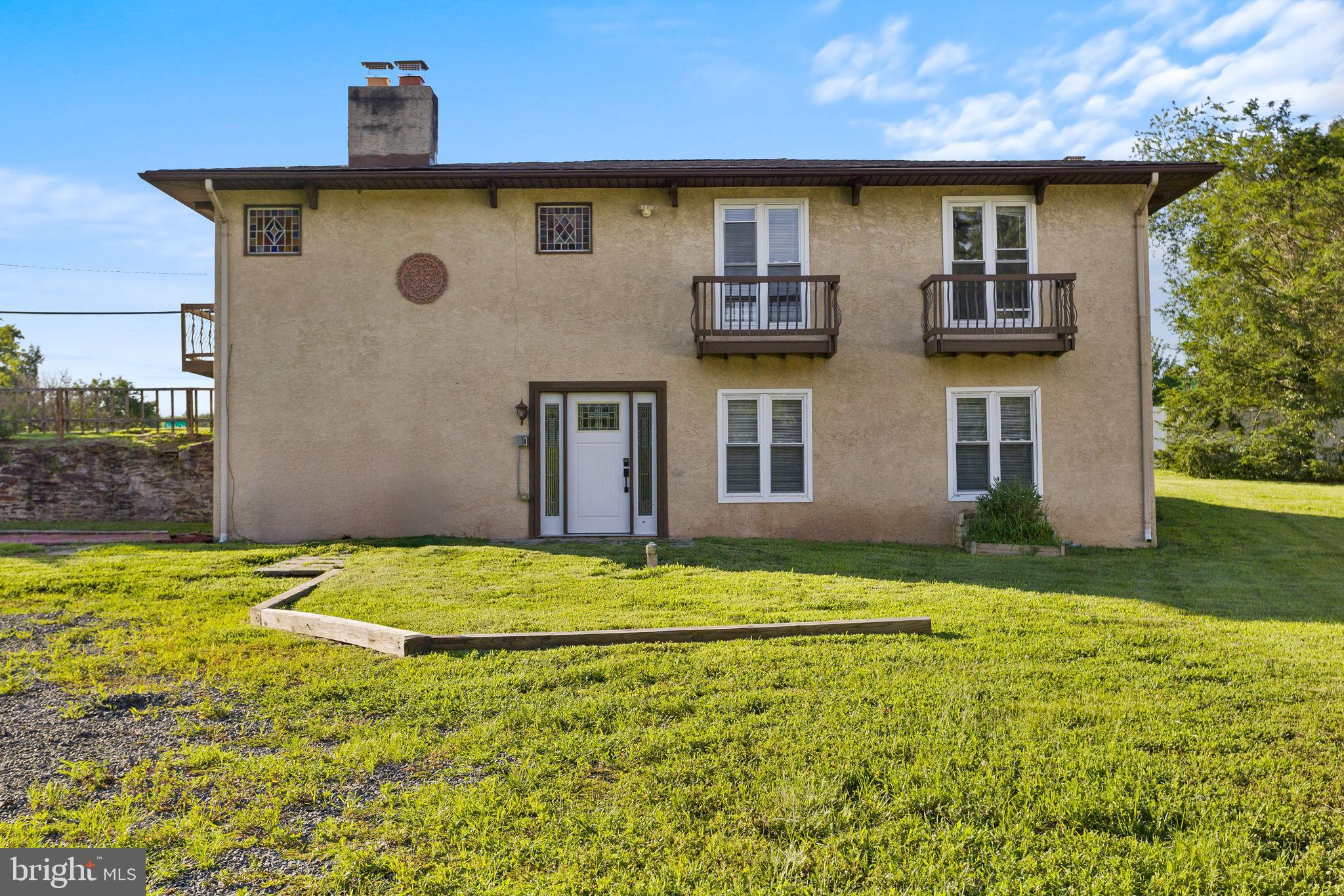 2264 Pennington Road Trenton, NJ 08638 - Photo 3 of 24 a front view of a house with a yard