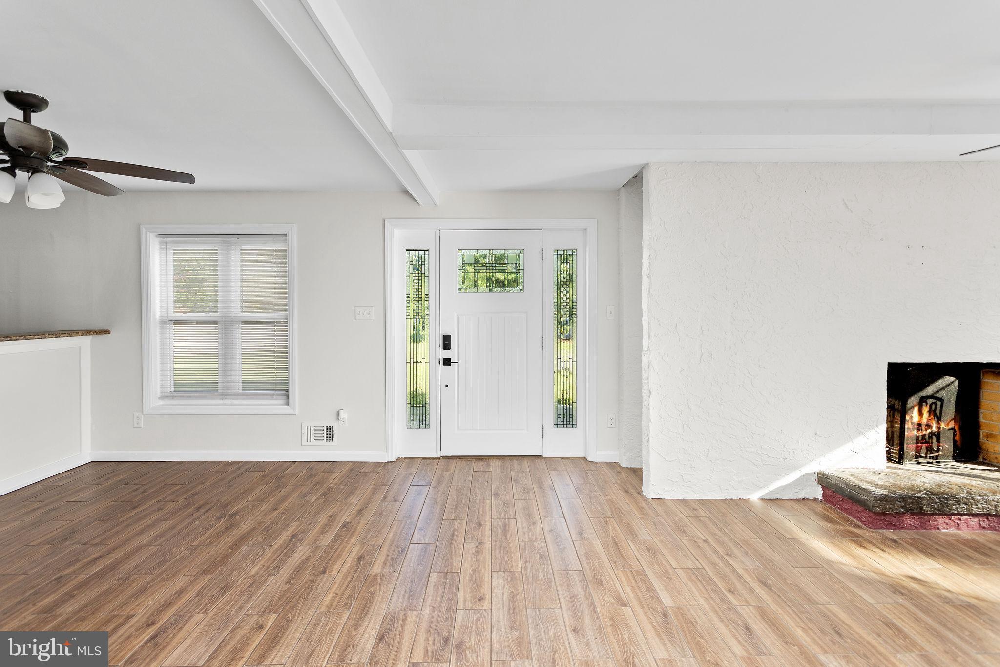 2264 Pennington Road Trenton, NJ 08638 - Photo 4 of 24 an empty room with wooden floor closet and windows