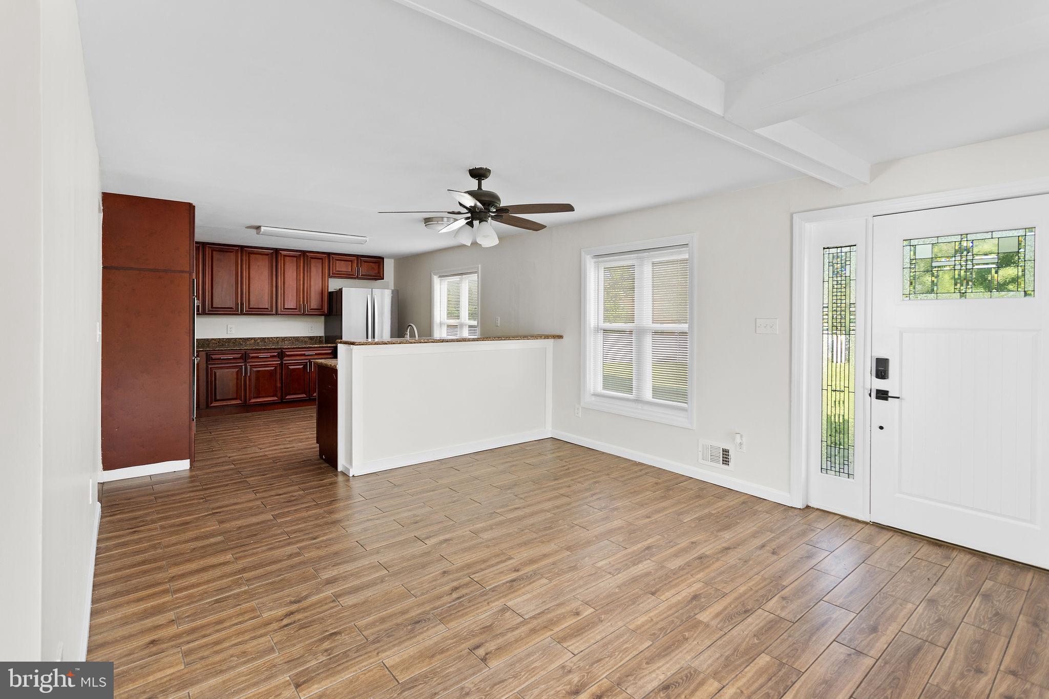 2264 Pennington Road Trenton, NJ 08638 - Photo 7 of 24 a view of a kitchen with a sink and a refrigerator