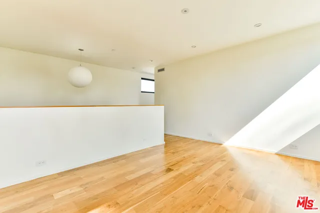 a view of a room with a large window