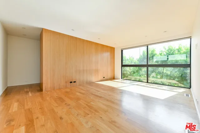 a bathroom with a granite countertop sink mirror and bathtub
