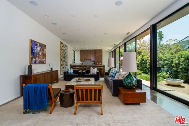 a kitchen with granite countertop a sink and a refrigerator