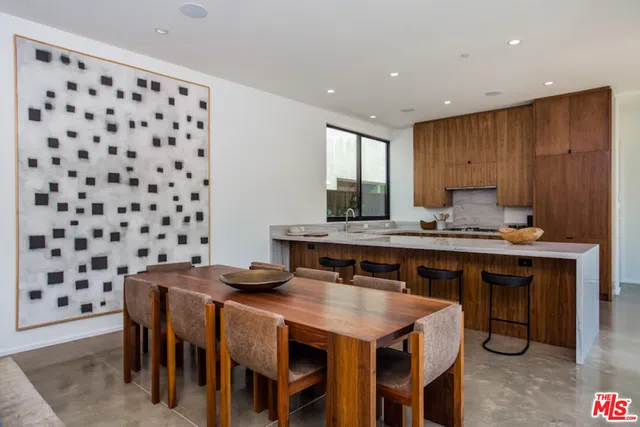 a kitchen with sink a stove and cabinets