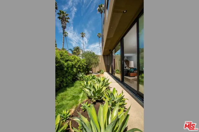 a room with furniture and large windows
