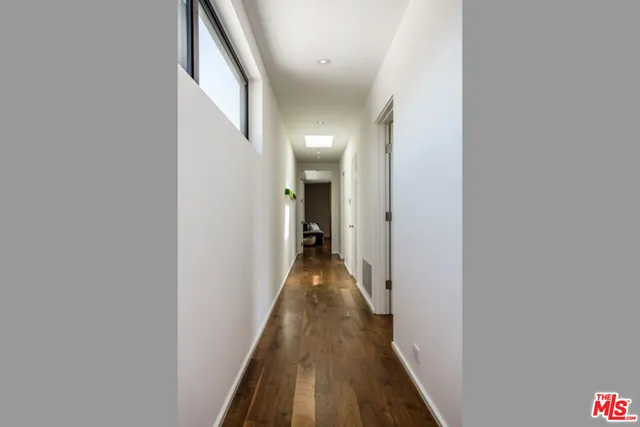 a bathroom with a sink toilet a mirror and shower