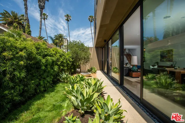 a view of a backyard with garden
