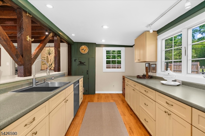 179 Lindbergh Road Hopewell, NJ 08525 - Photo 17 of 46 a large kitchen with granite countertop a sink and dishwasher with a large window
