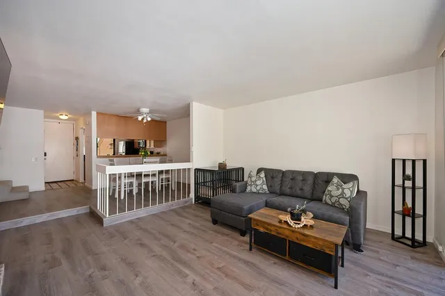 a kitchen with stainless steel appliances granite countertop a refrigerator stove and microwave