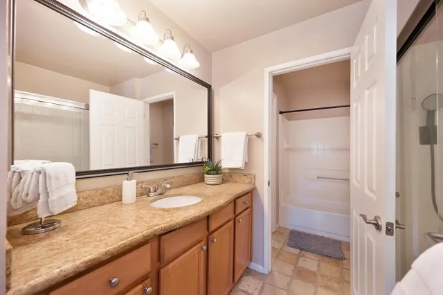 a view of a livingroom with workspace and a window