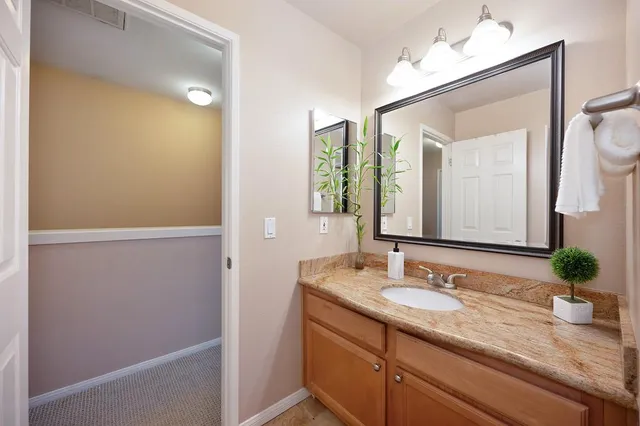 a view of a livingroom with workspace and a window