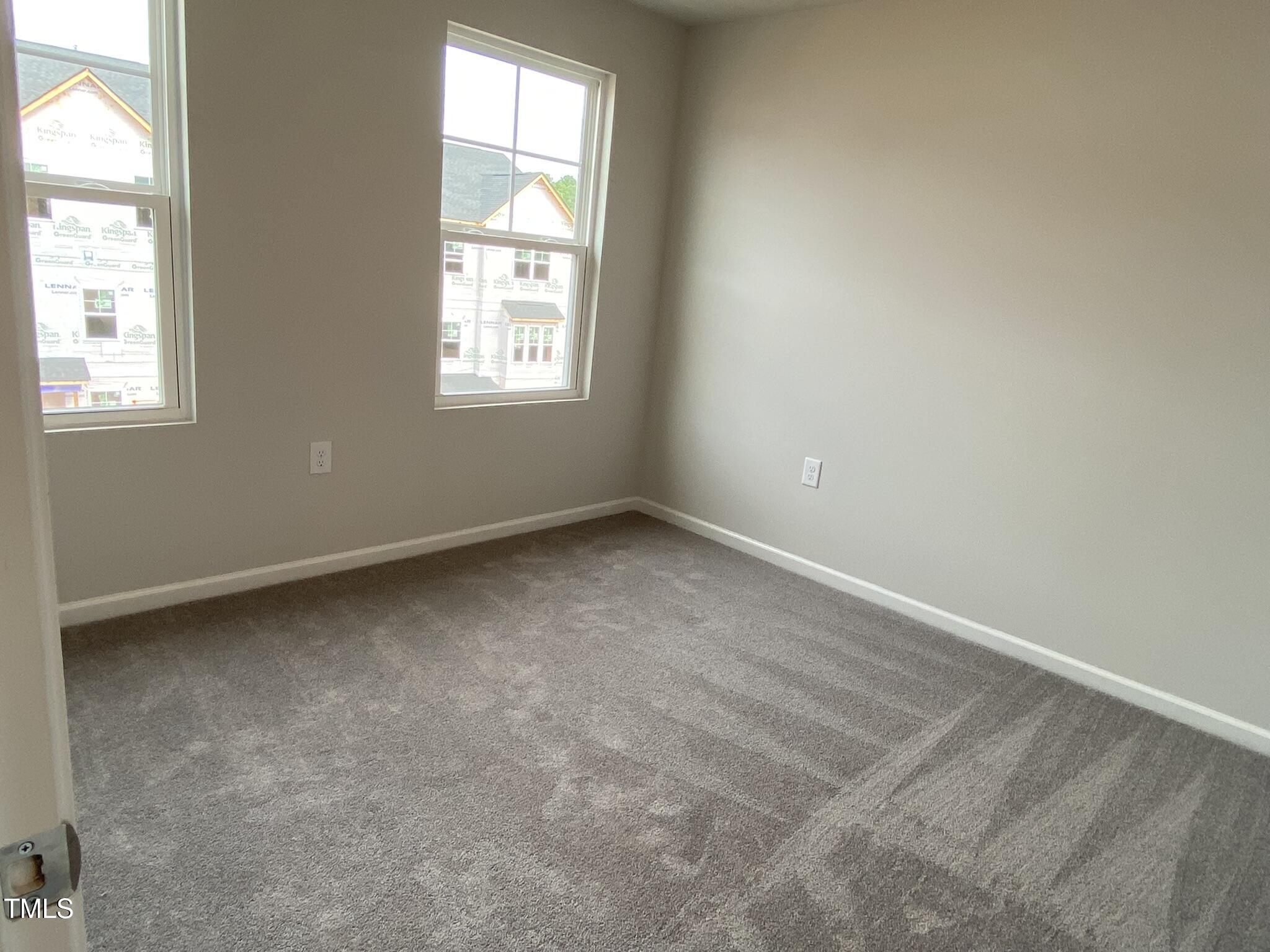 722 Gimari Drive Wake Forest, NC 27587 - Photo 20 of 25 an empty room with windows