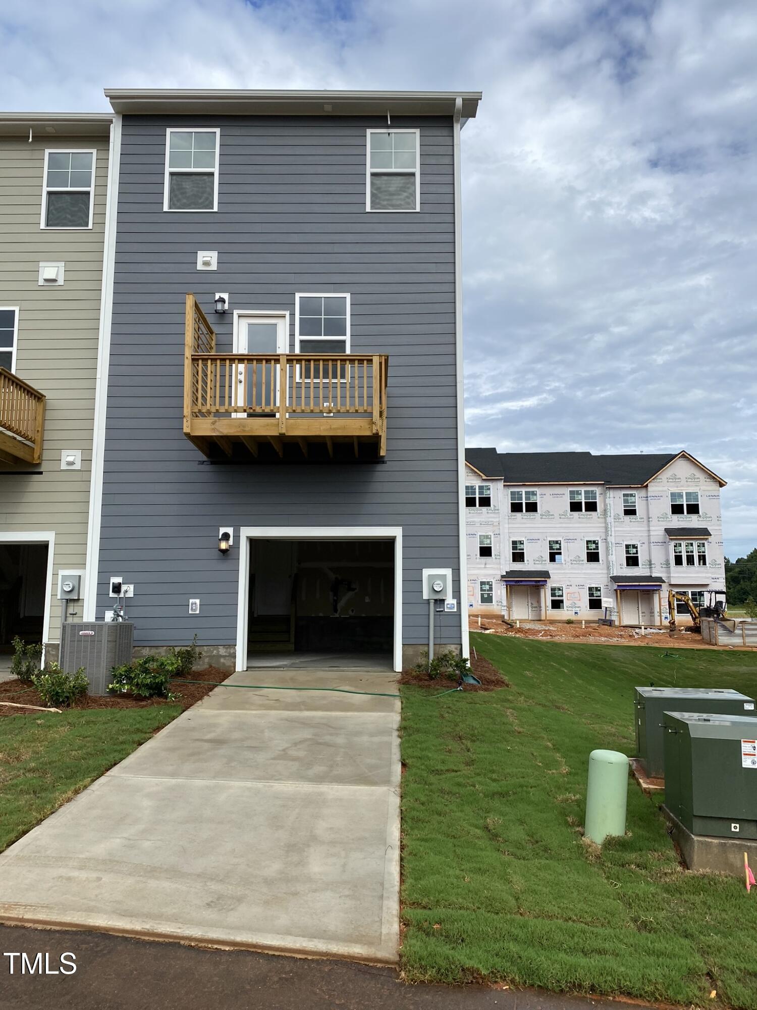 722 Gimari Drive Wake Forest, NC 27587 - Photo 24 of 25 a view of a house with a yard fire pit and a large tree