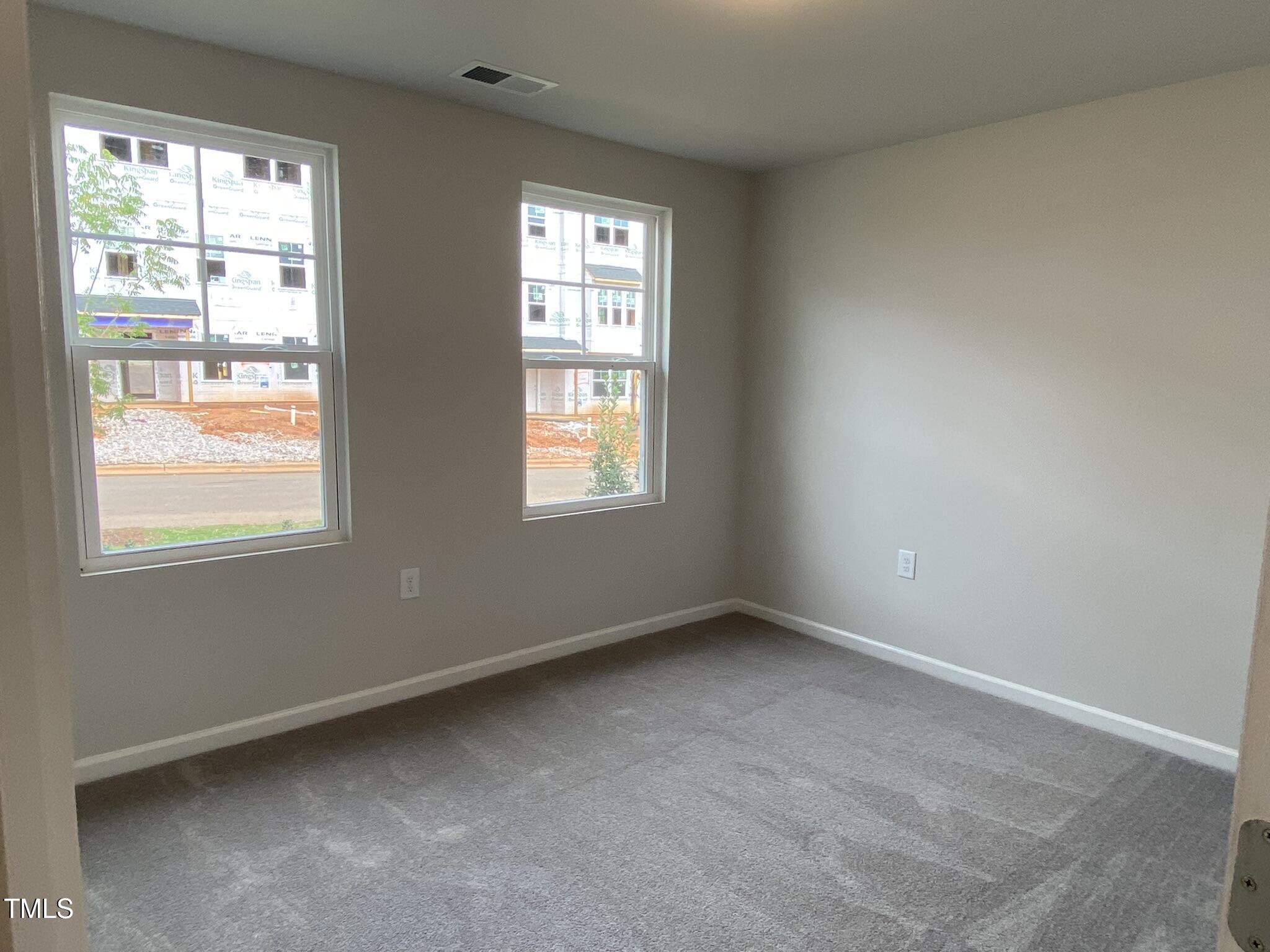 722 Gimari Drive Wake Forest, NC 27587 - Photo 4 of 25 an empty room with a window