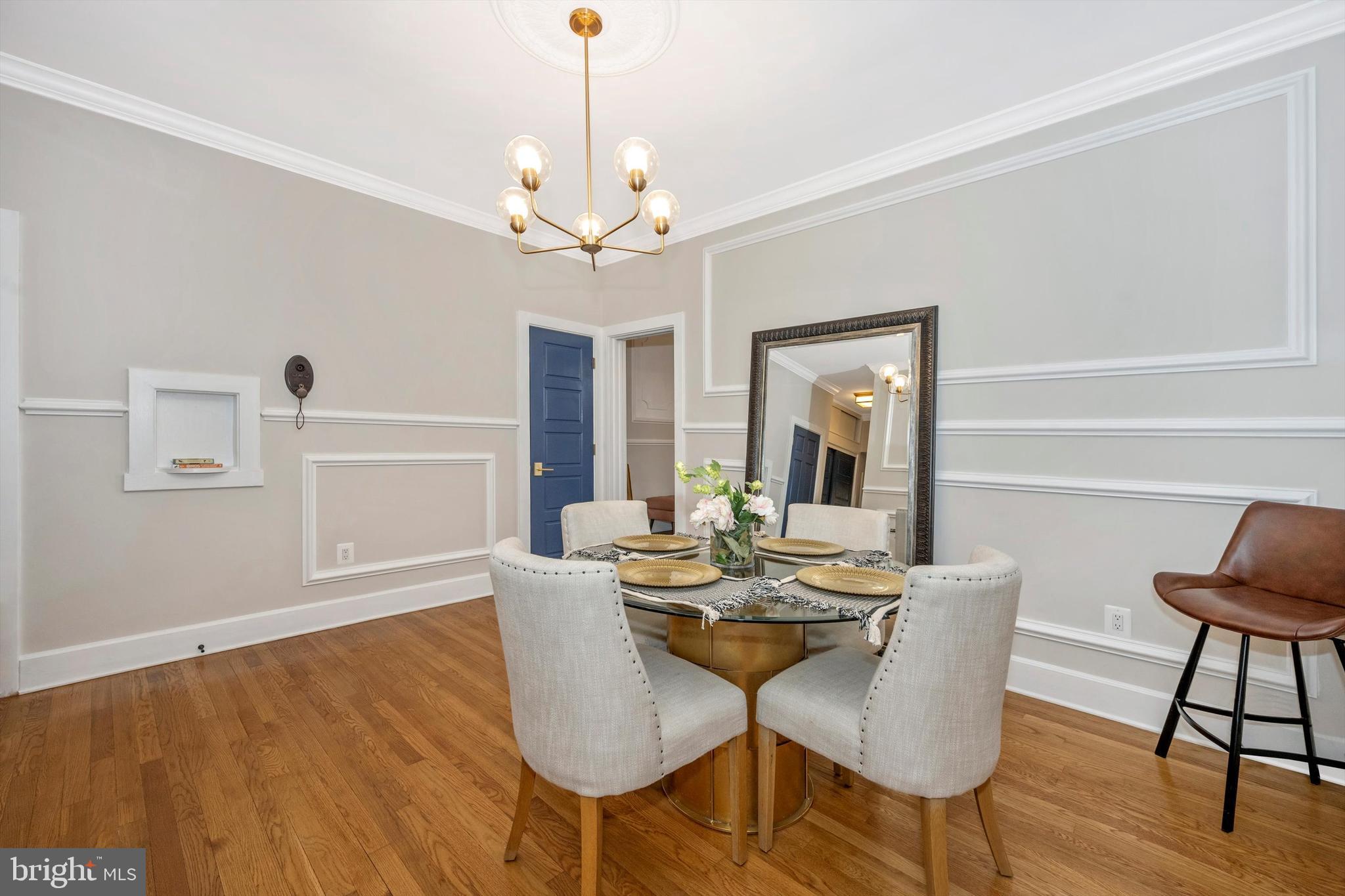 125 West Church Street, Unit B Frederick, MD 21701 - Photo 12 of 60 a view of a dining room with furniture wooden floor and chandelier