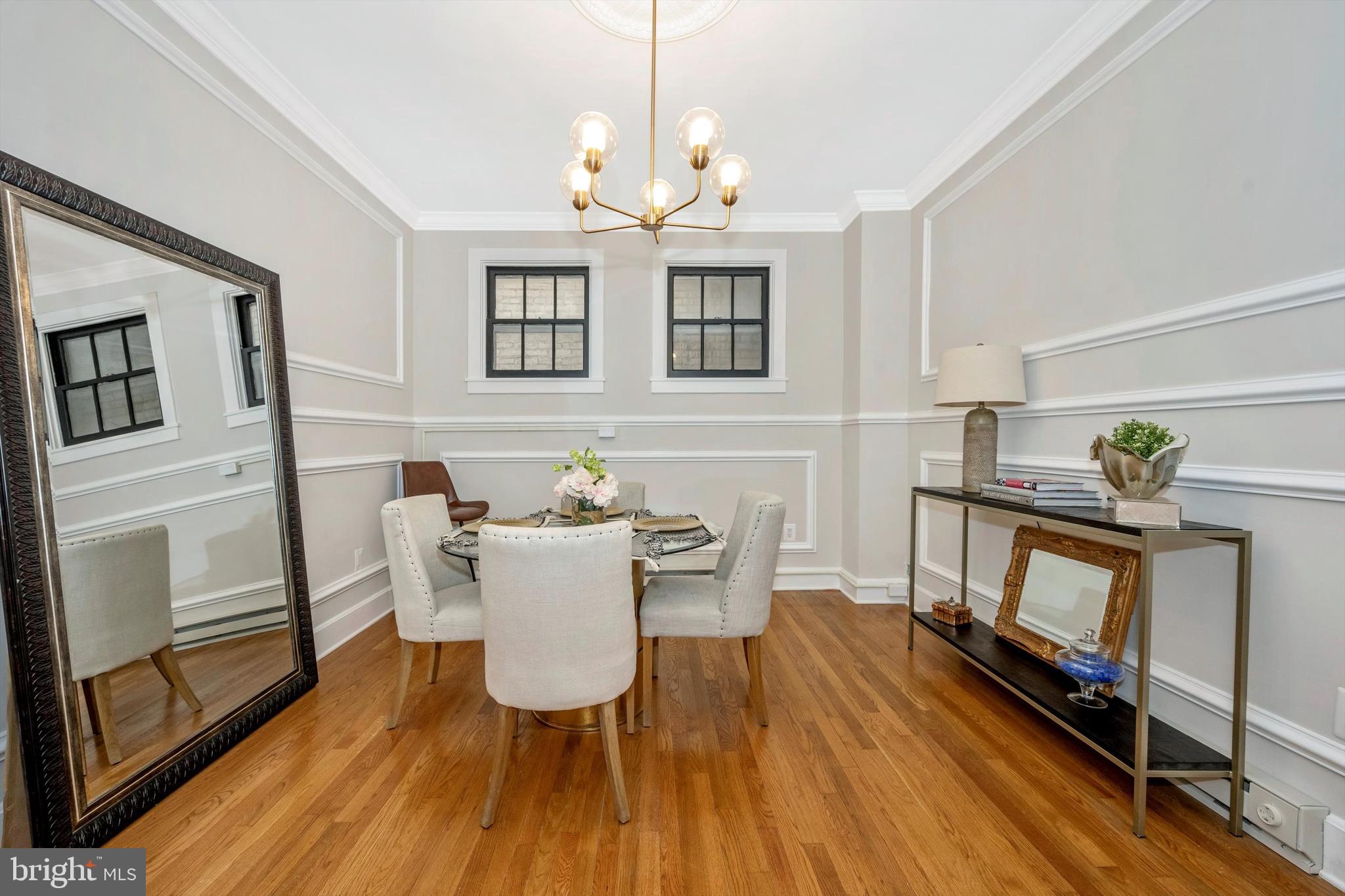 125 West Church Street, Unit B Frederick, MD 21701 - Photo 14 of 60 a living room with furniture a fireplace and a chandelier