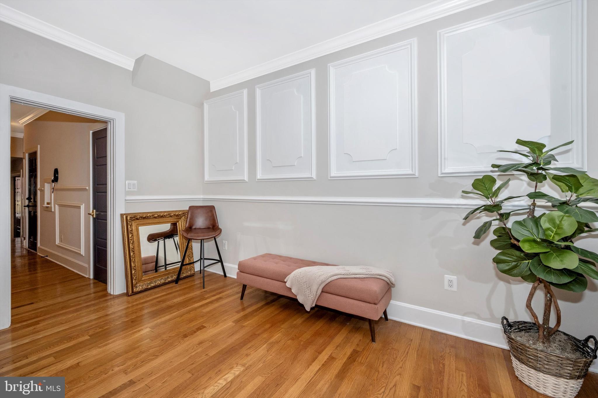 125 West Church Street, Unit B Frederick, MD 21701 - Photo 19 of 60 a living room with furniture flowerpot a potted plant and wooden floor